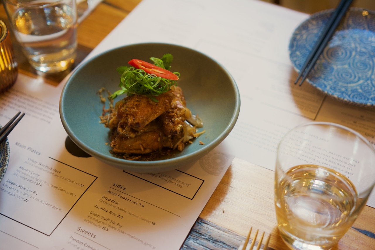 A Paper Plate dish served at a warmly lit table